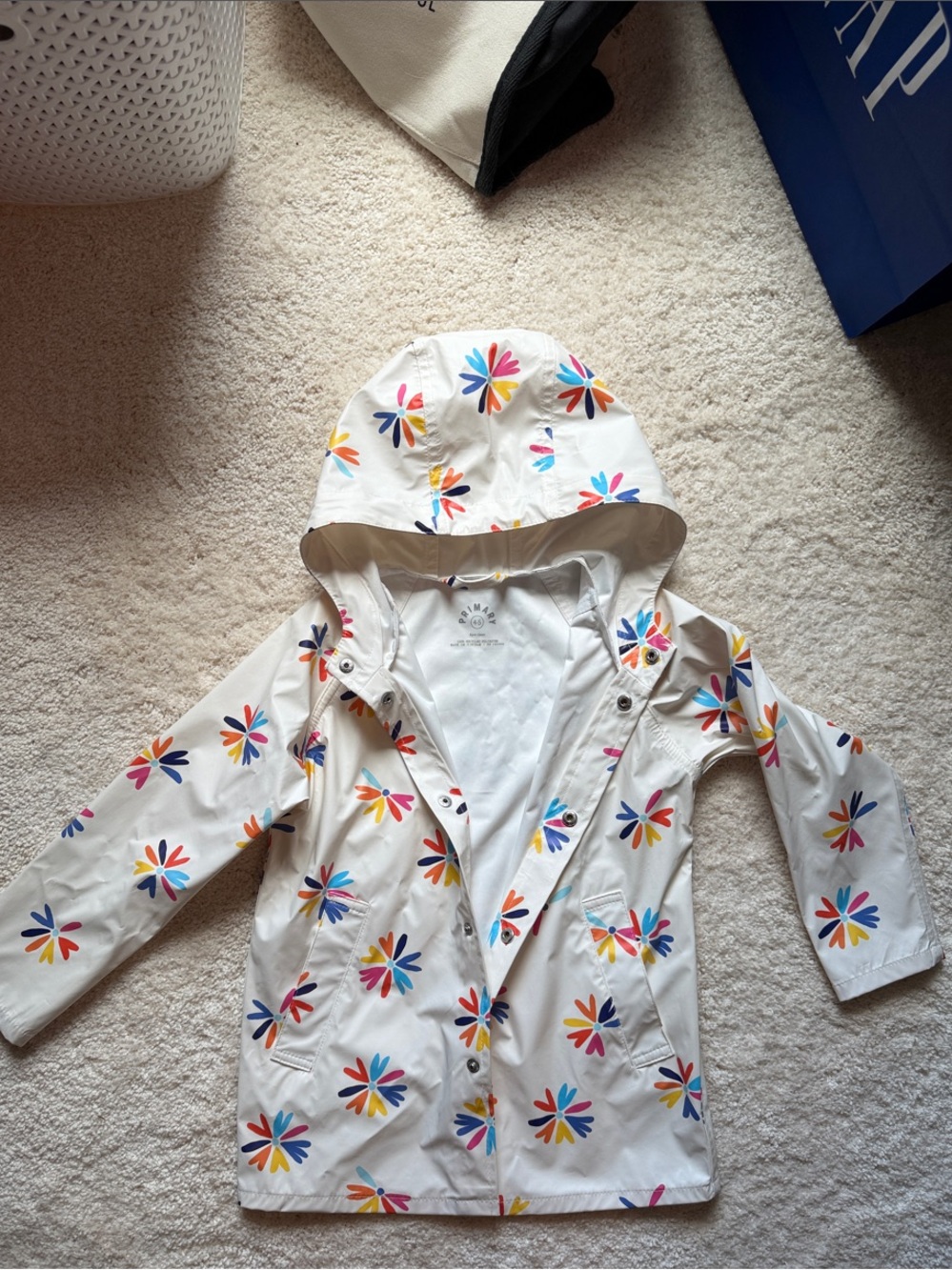 Primary White Raincoat with Multicolor Flower Print